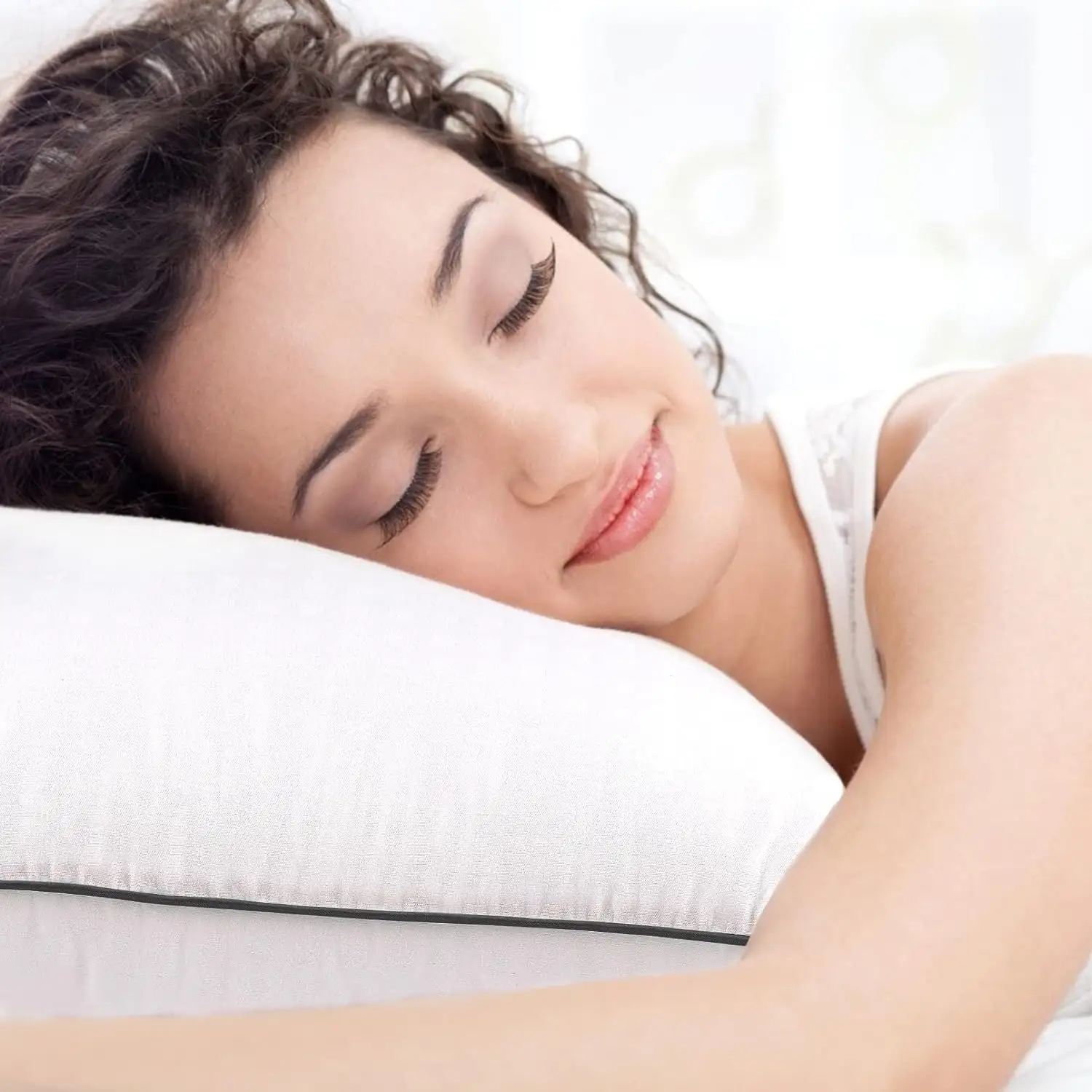 A peaceful person sleeping comfortably with hypoallergenic bedding in a clean, allergy-free bedroom